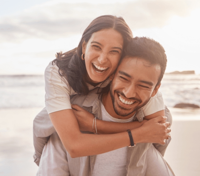 Smiling woman with great hair holding her partner